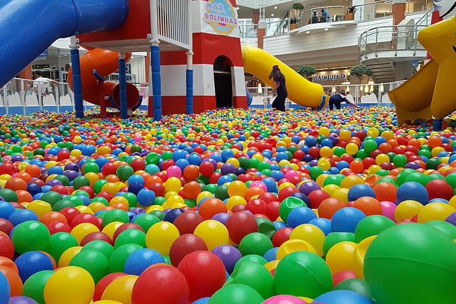 A ball pit with slides and a play structure